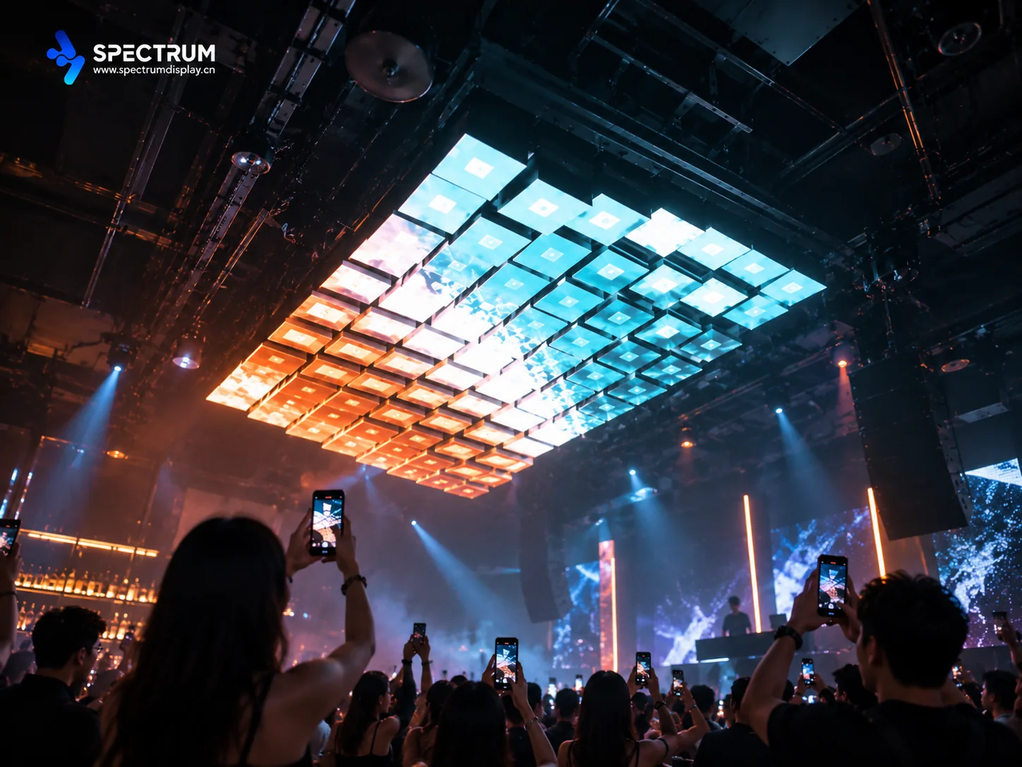 Spectrum Display SPKI-160 kinetic LED screen installed on the ceiling of a Singapore bar - visitors holding up phones to photograph the moving ceiling